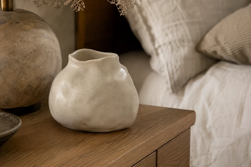 Handmade ceramic vase with organic form, illustrated